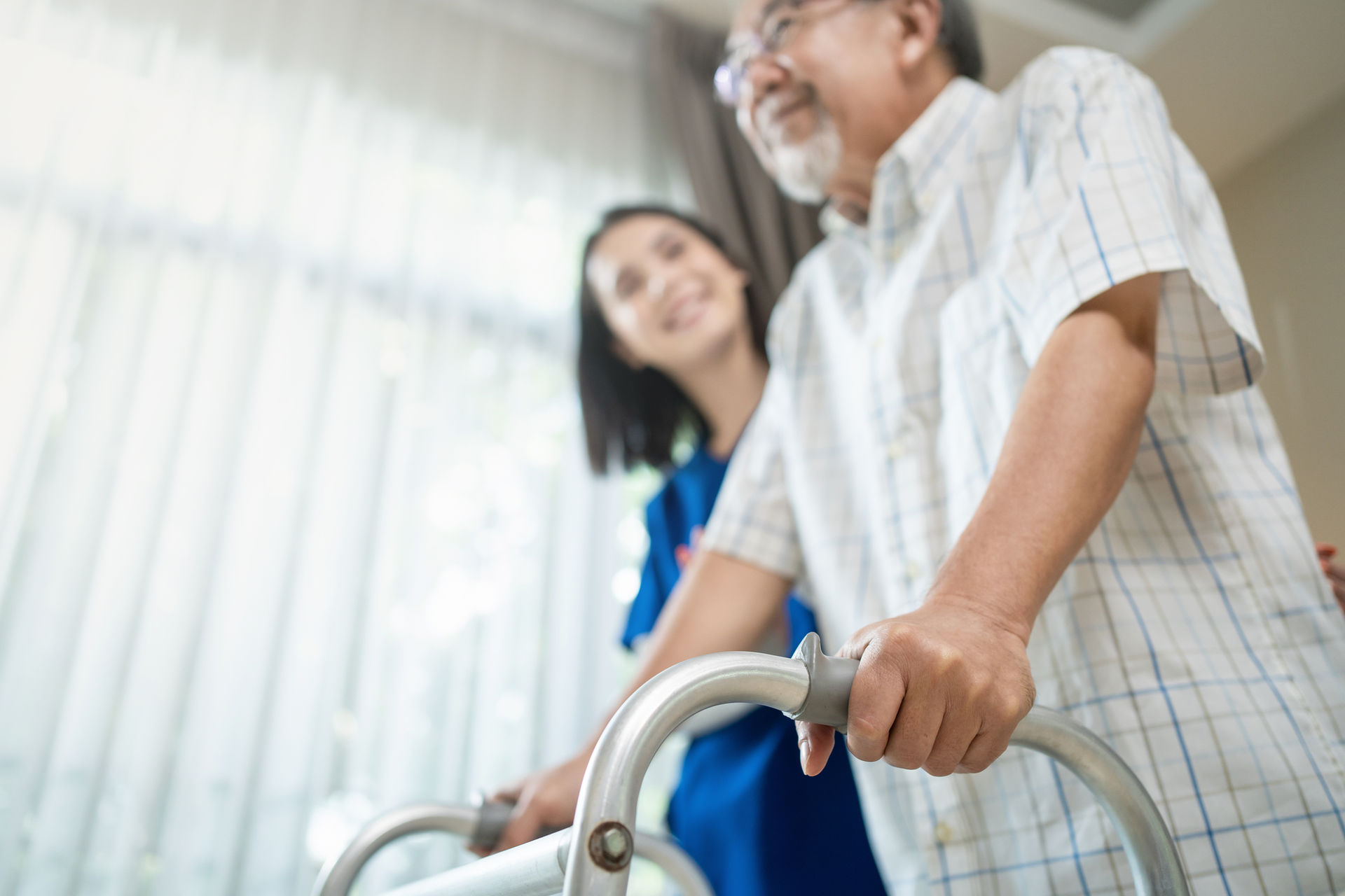 A home health nurse caring for an elderly patient